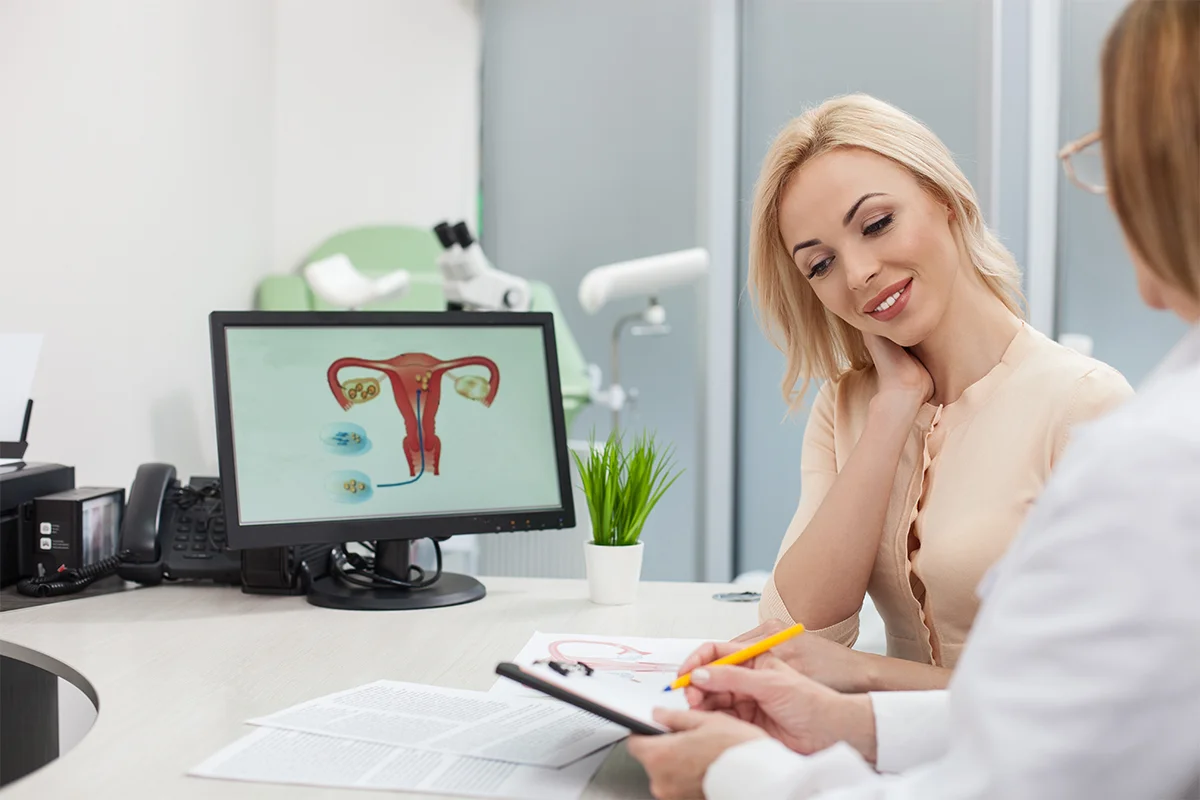 Young blonde woman talking to egg donation expert