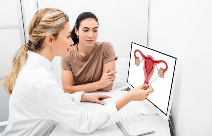 Blonde woman gynecologist explaining birth control to her patient