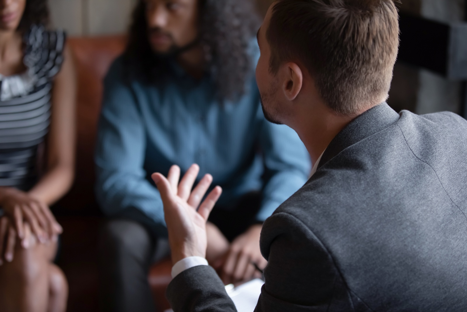 Close up of an egg bank meeting with an African American couple at meeting.